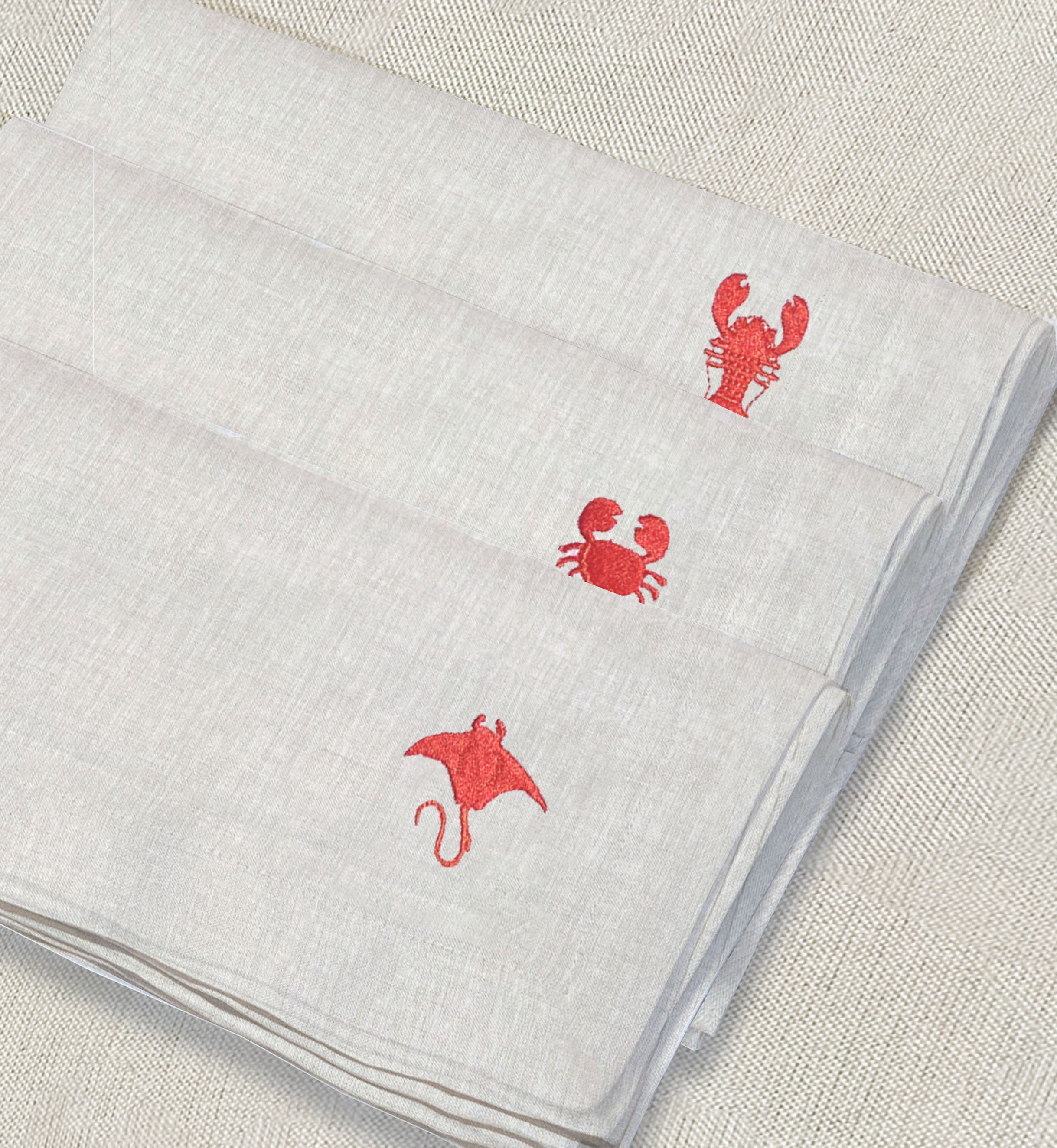 servilleta de lino arena bordado mariscos