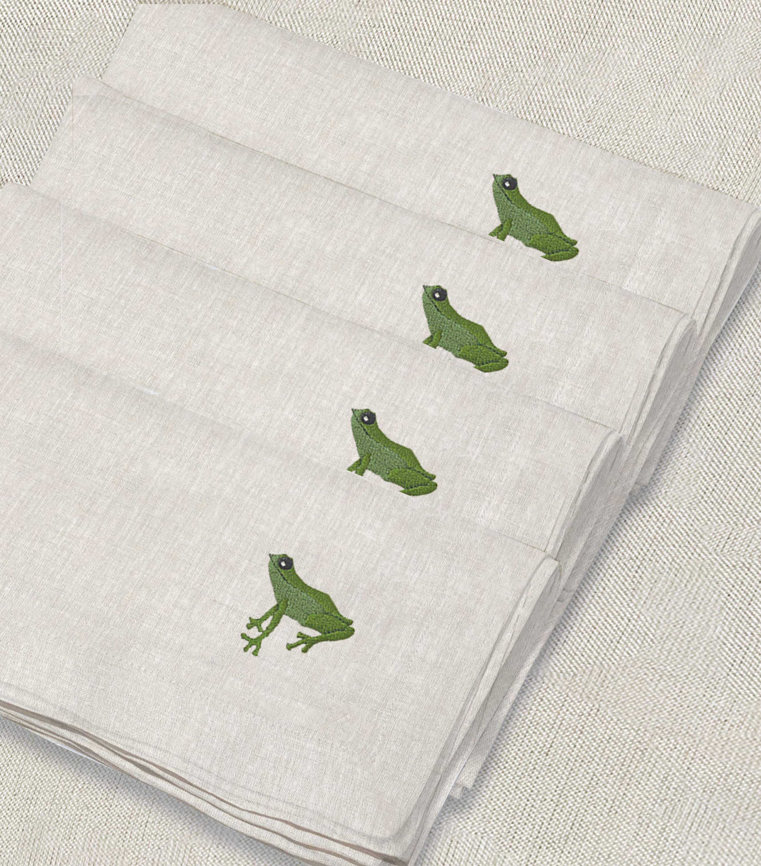 servilleta de lino arena bordado rana