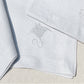 individual y servilleta de lino gris bordado mariscos